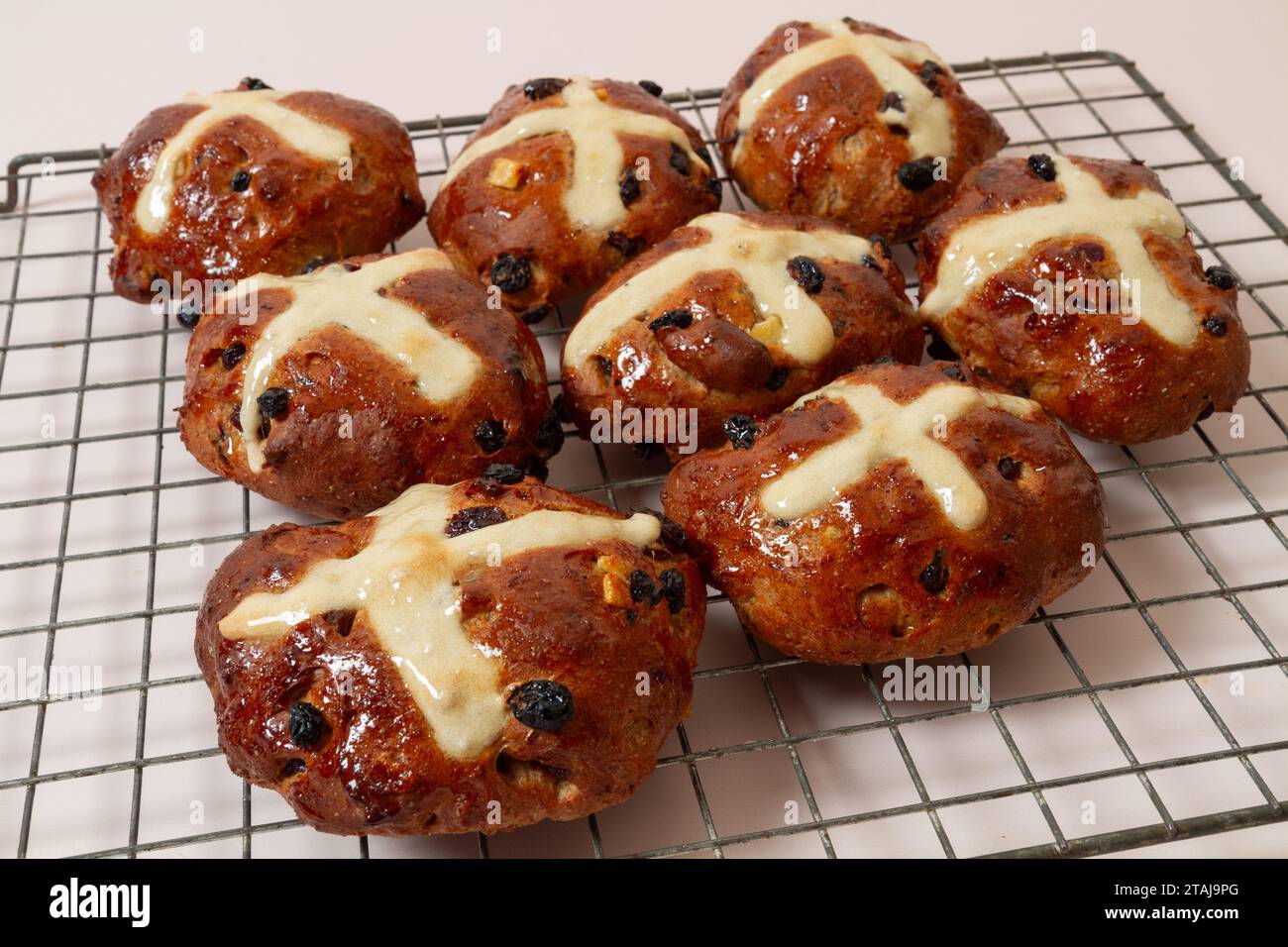 Hot cross buns on wire rack Stock Photo