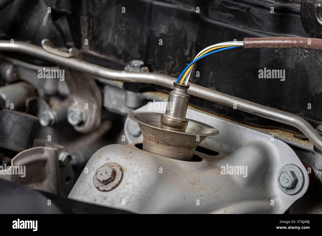 Oxygen sensor on car engine. Automotive repair, maintenance and service