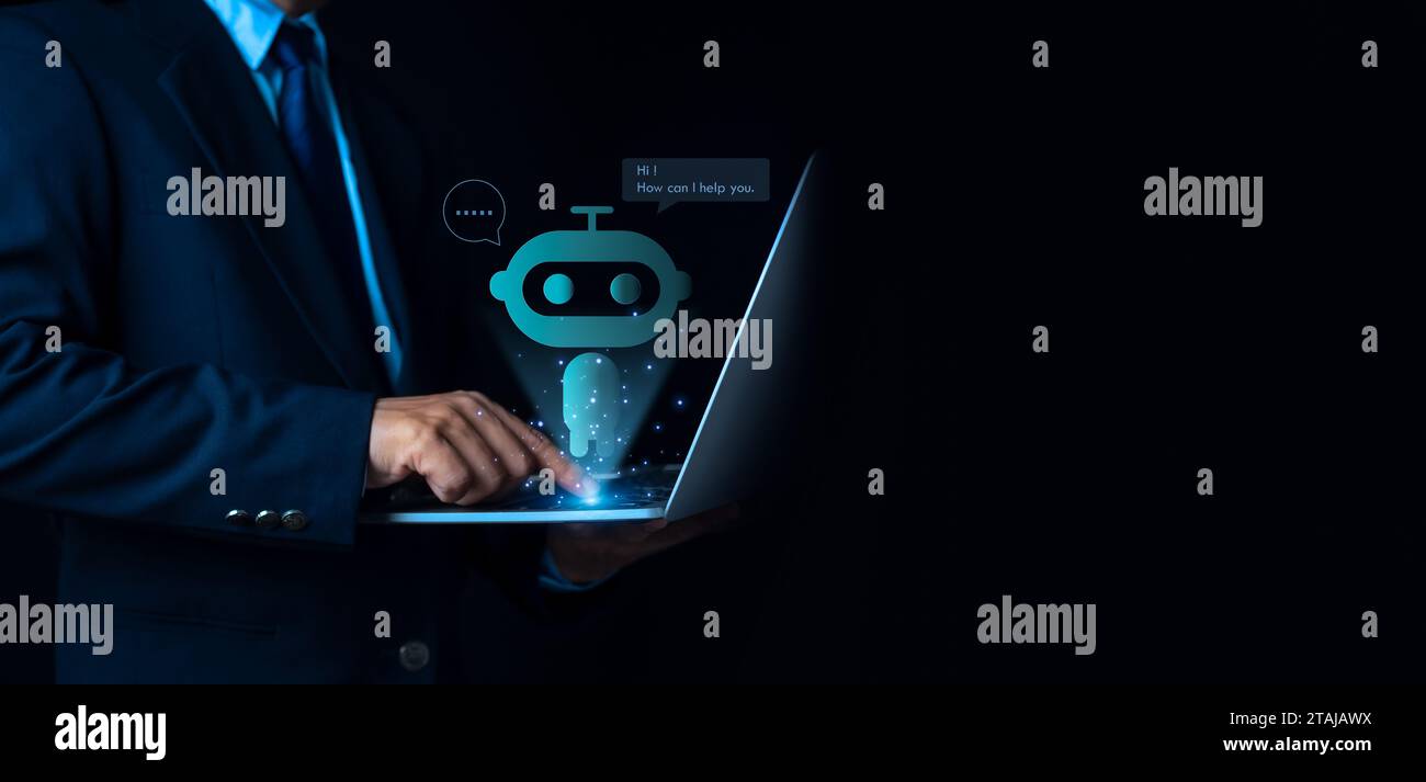 Businessman uses computer to type chat Ask and answer with the artificial intelligence system, chatbot, AI assistant. Stock Photo