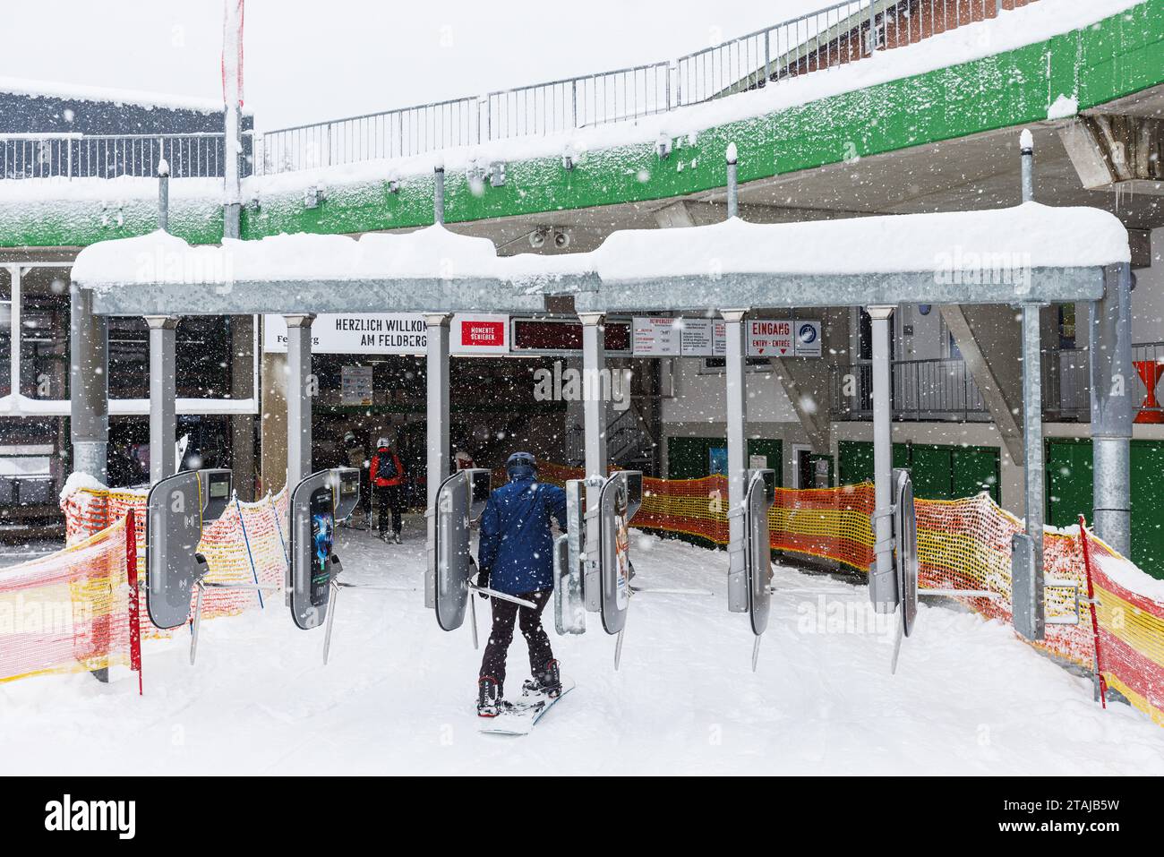 Feldberg, Germany. 01st Dec, 2023. A winter sports enthusiast passes through a turnstile at the
