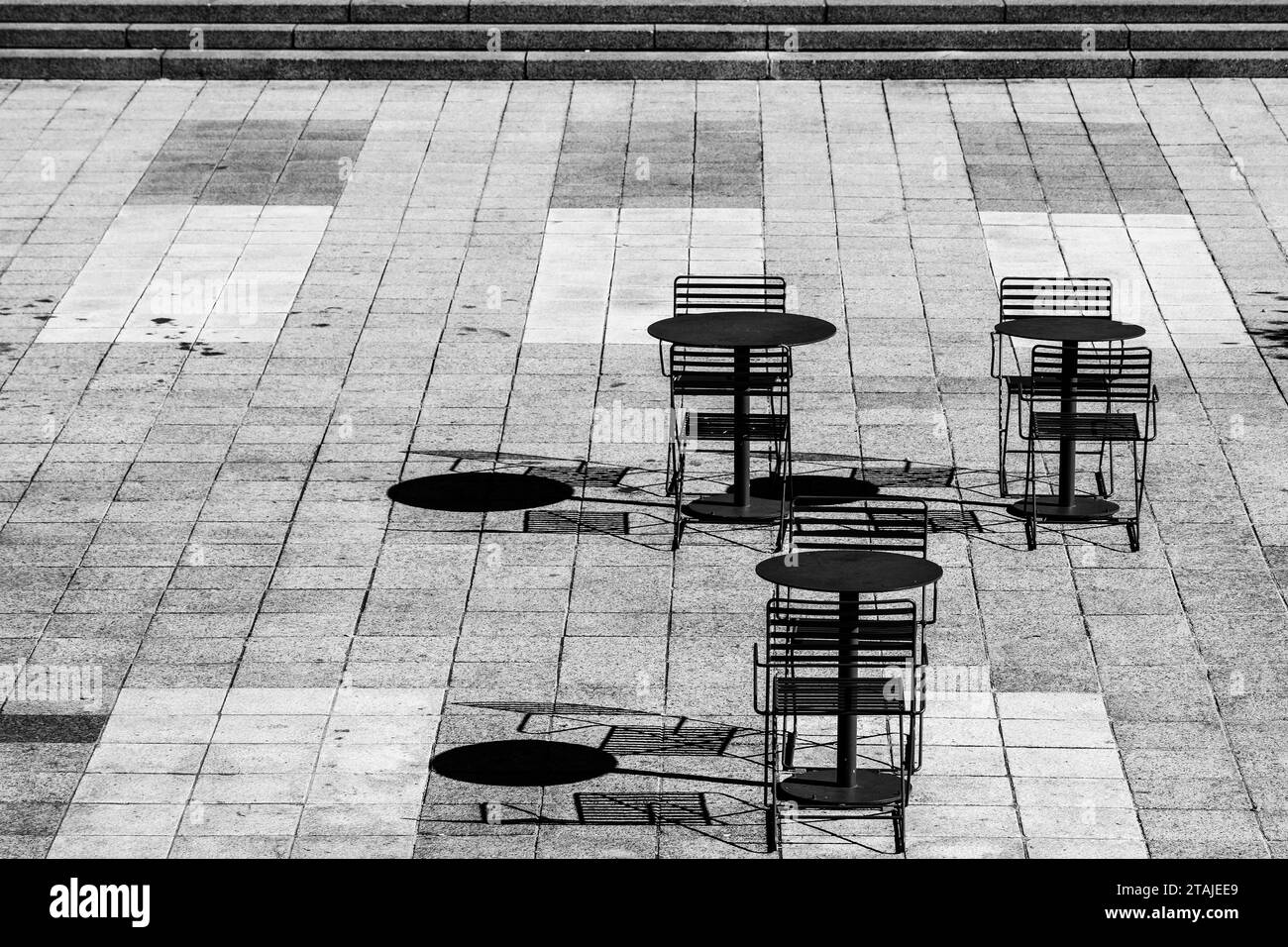 Monochrome dining pation with shadows and strong contrast Stock Photo