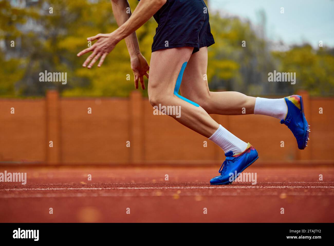 Dynamic strides hinting at leap. Cropped photo of male