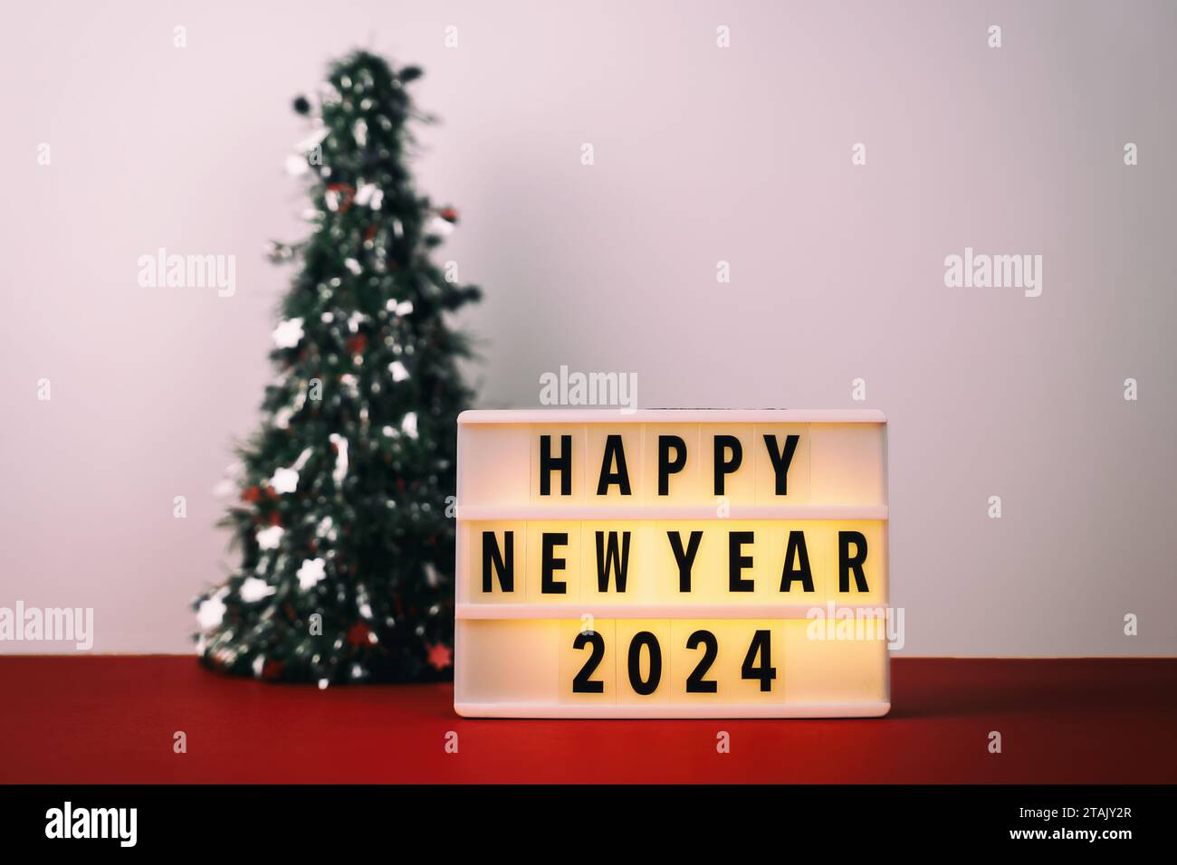 Happy New Year 2024 on Light box Stock Photo