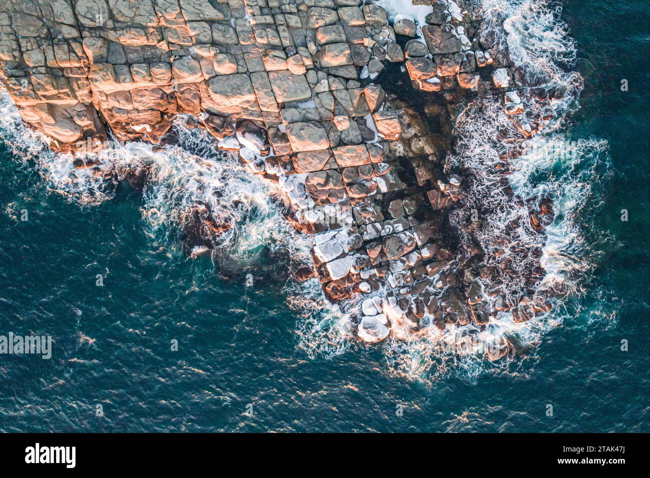 Aerial top down view of an ocean blue waves breaking on the rocks Stock ...
