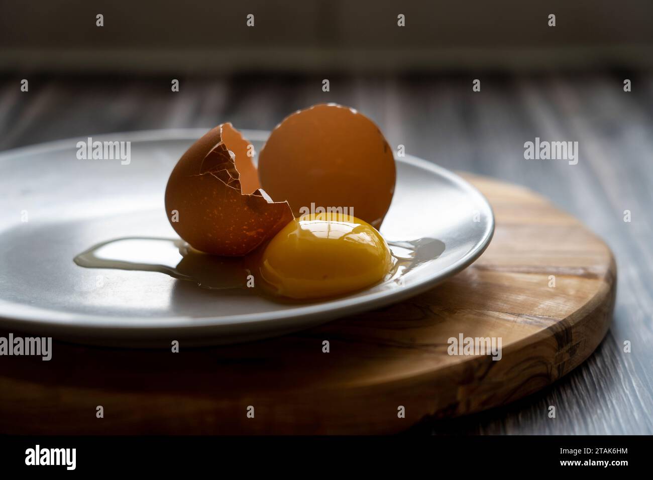 Fresh egg yolk on a plate Stock Photo