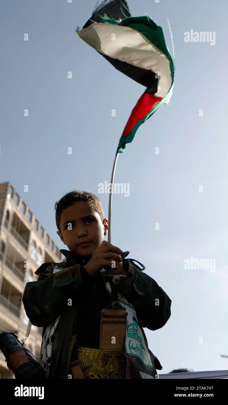 SANAA, Sanaa, Yemen. 1st Dec, 2023. A boy waves Palestinian flag during ...