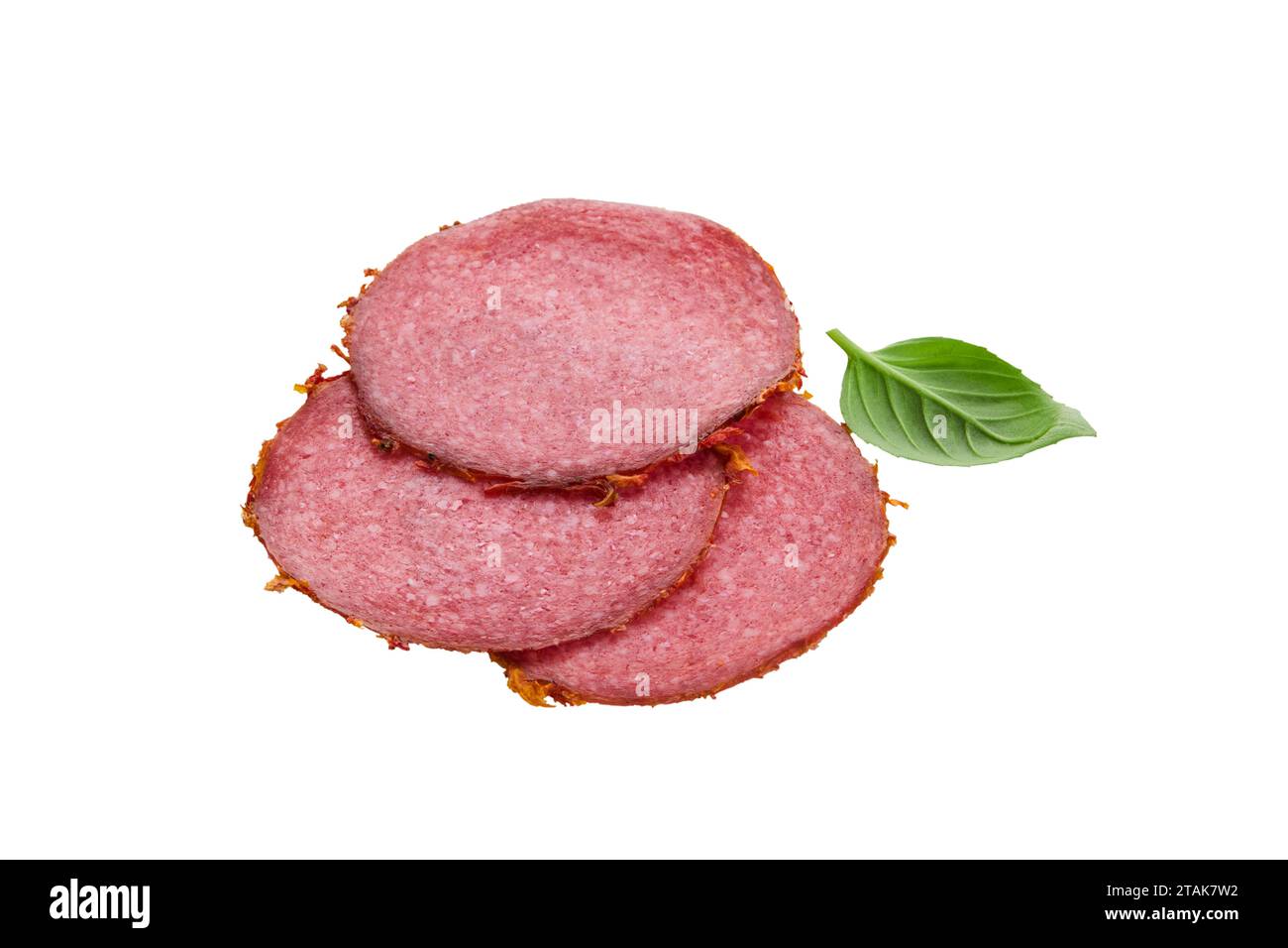 Salami sausage slices and leaf green basil isolated on white background. Few pieces or several slices. High resolution image. Can be used for self-des Stock Photo