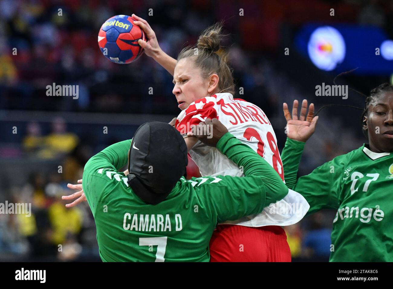 Croatia's Andrea Simara (28), Senegal's Doungou Camara (7) and Dienaba