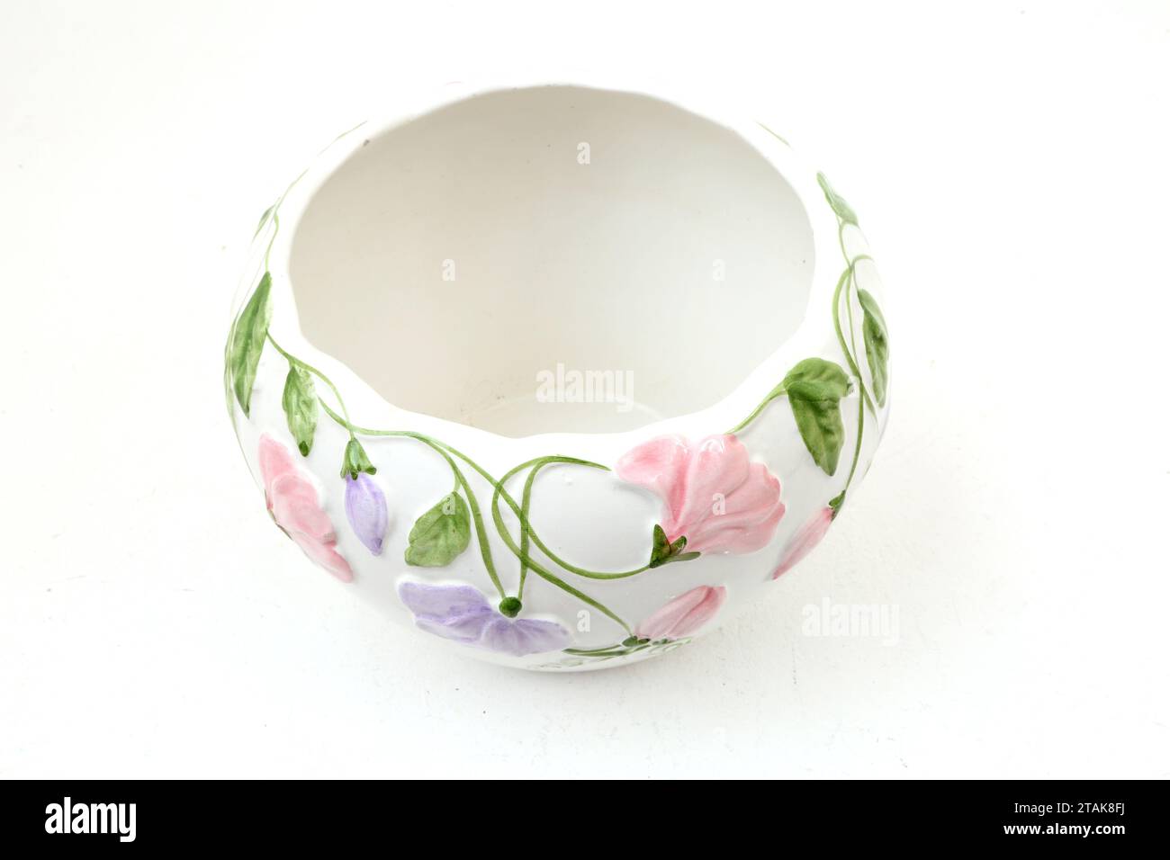 White Ceramic Bowl with Pink and Mauve Floral Design Stock Photo