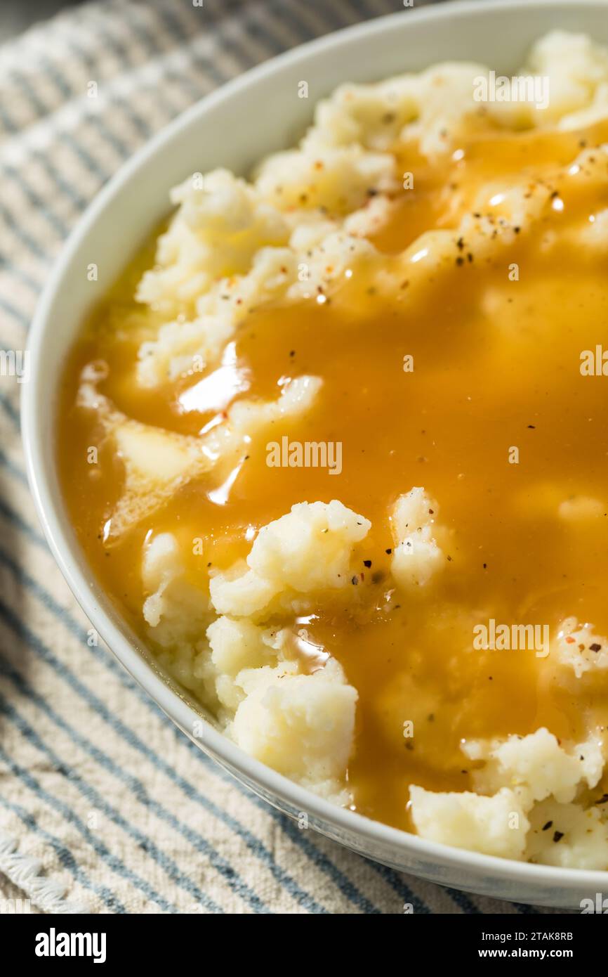 Homemade Turkey Gravy and Mashed Potatoes with Butter Stock Photo