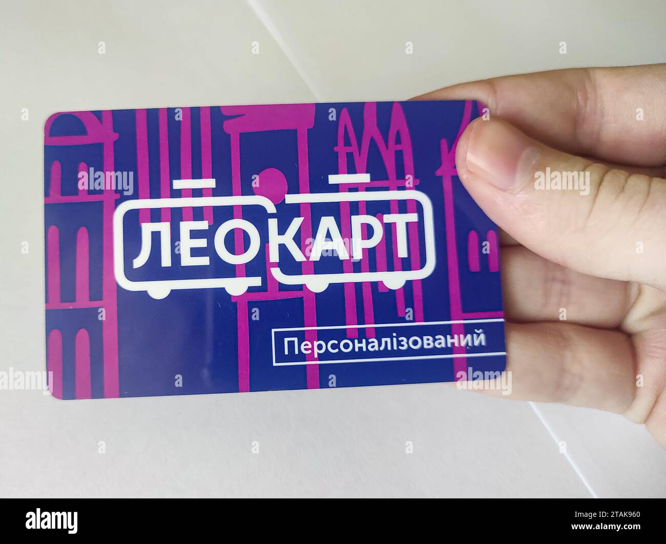 public transport card from Lviv, held in hand. You can pay for any type of public transport with it, within the city Stock Photo