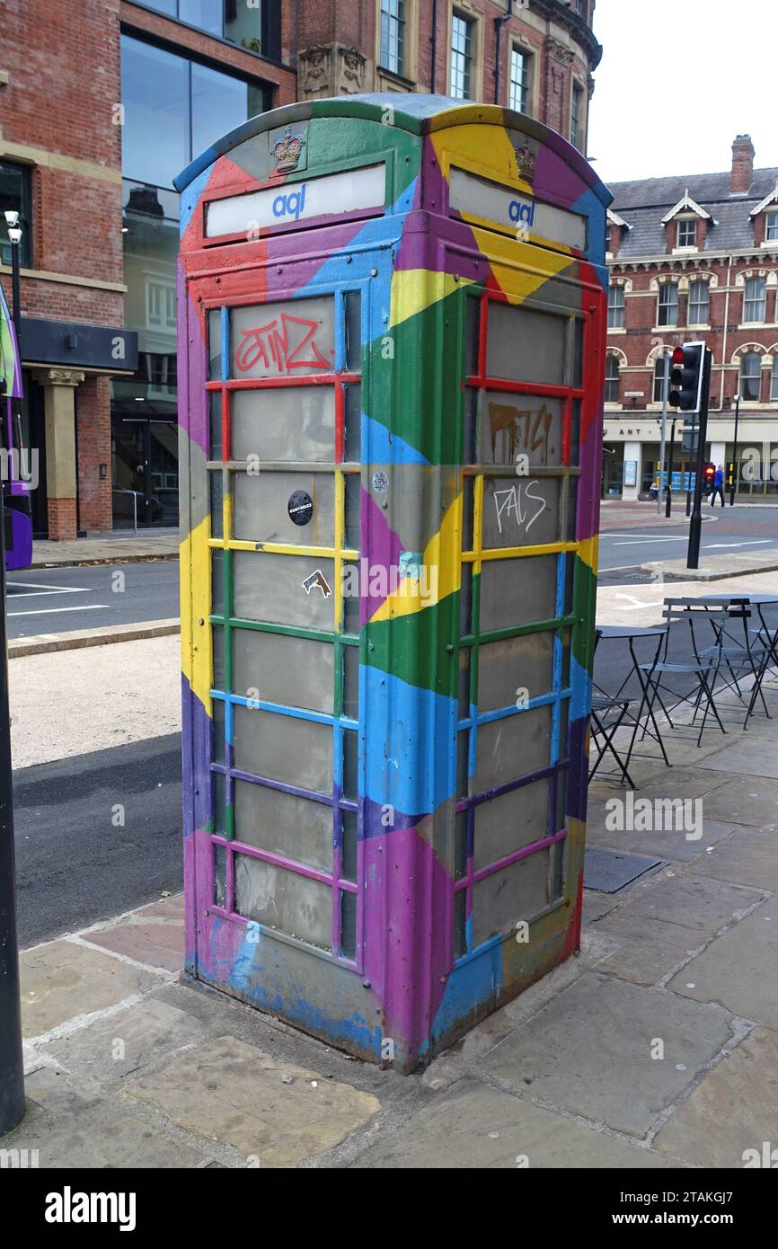 Colourful multi-coloured painted UK Telephone box Stock Photo