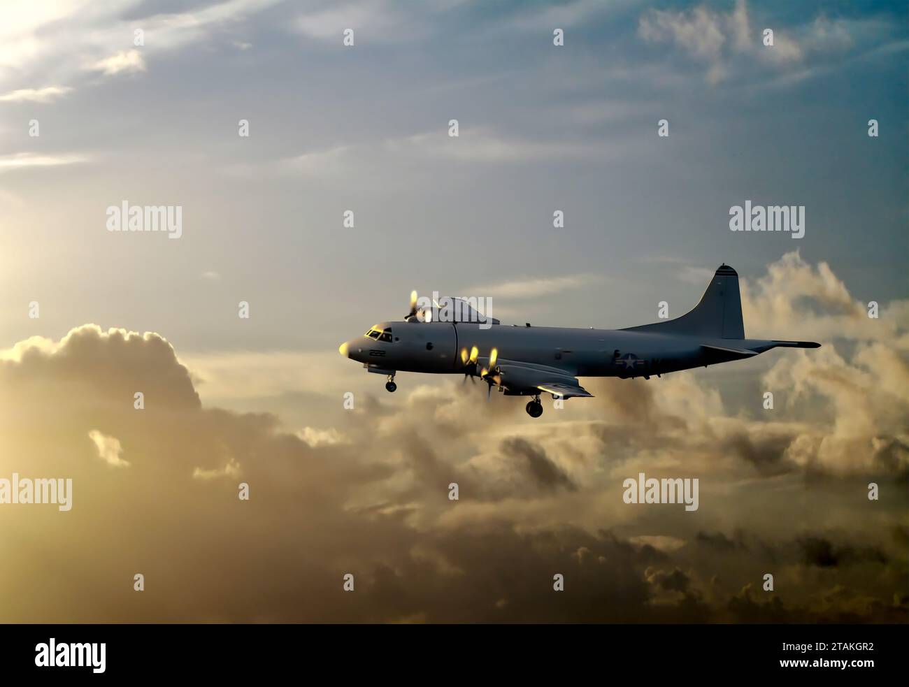 Lockheed P-3 Orion landing in Hilo Hawaii at sunset Stock Photo
