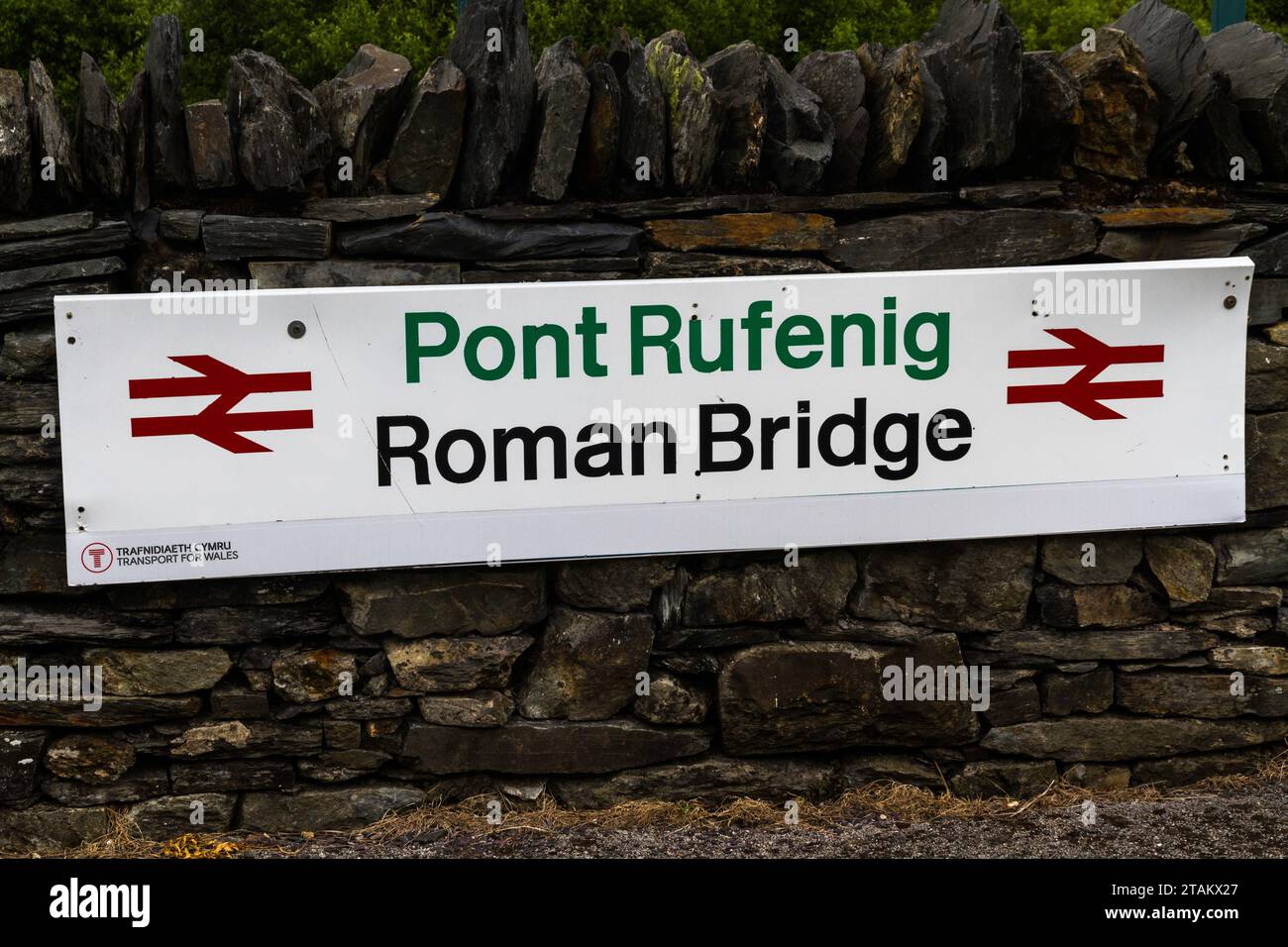 PONT RUFINEIG, WALES – JUN 14 2022: Sign for Roman Bridge Railway Station, landscape Stock Photo