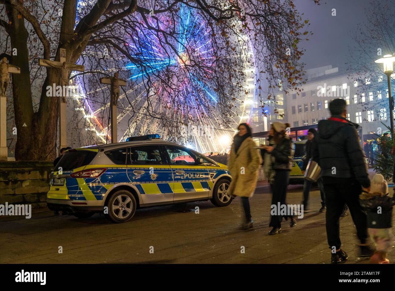 Police patrol in the pre-Christmas period, Christmas market in the city centre of Essen, police car at the Ferris wheel on Kettwiger Straße, NRW, Germ Stock Photo