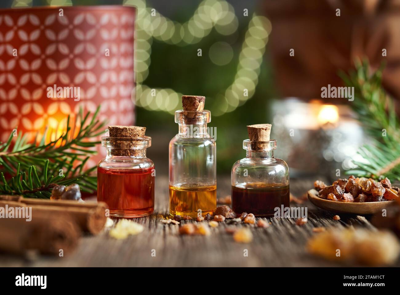 Bottles of essential oil with frankincense and myrrh resin with Christmas decoration Stock Photo