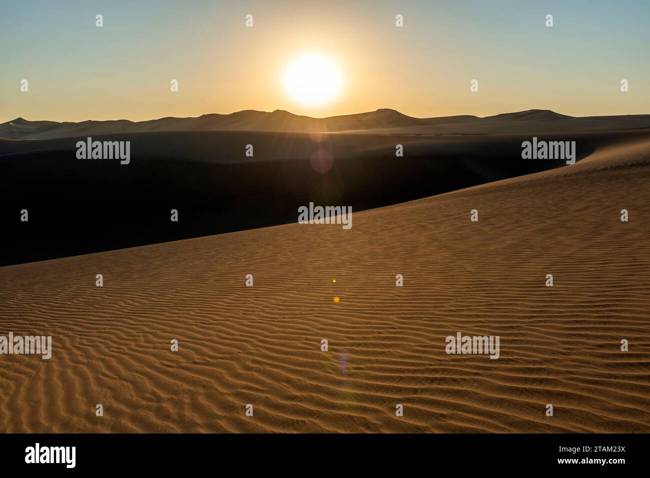 Nazca desert at sunset with lens flare between Ica and Huacachina, Peru. Stock Photo