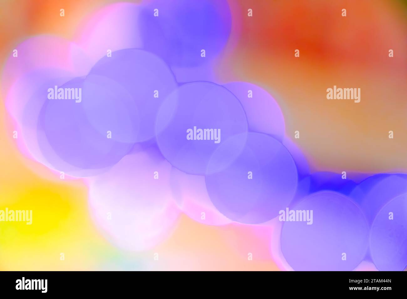 Abstract blurry colorful pastel bokeh light circles glowing, relaxing magical background Stock Photo