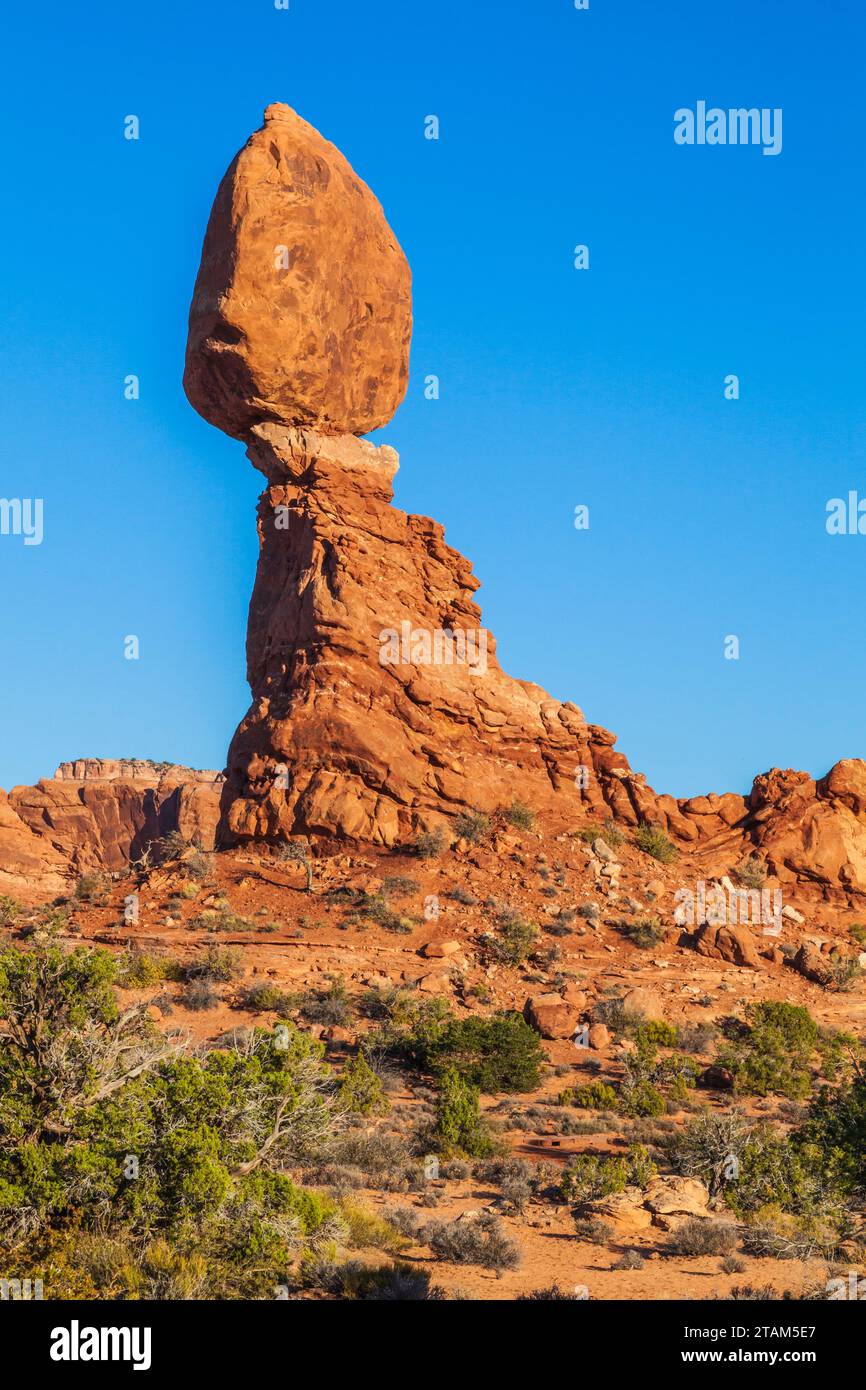 Balanced Rock formation at sunset in Arches National Park in Utah. Stock Photo