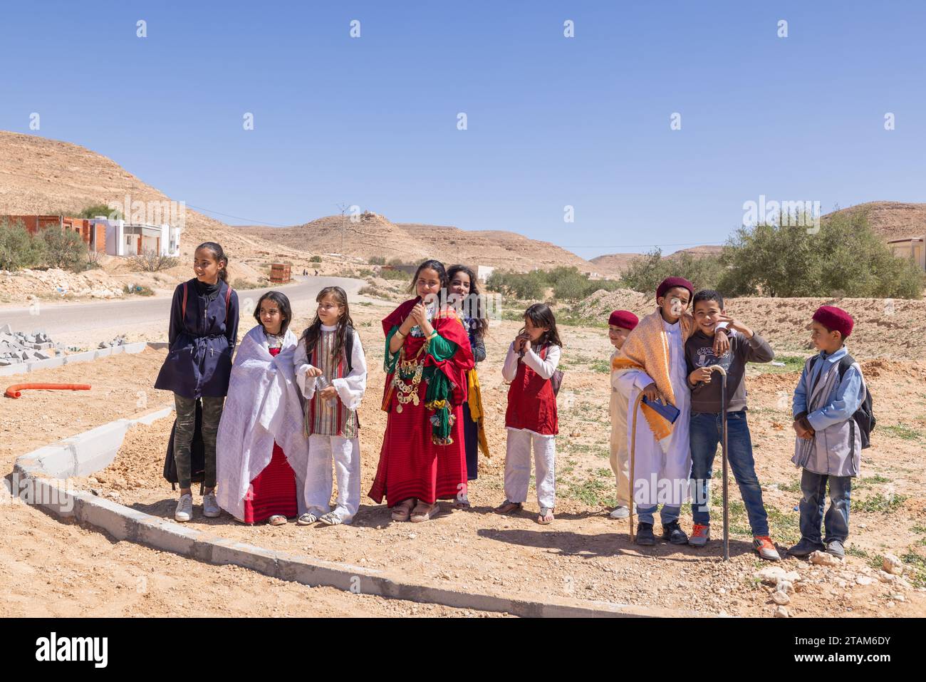 Tunisia. March 17, 2023. Children in traditional dress in the Tunisian desert. Stock Photo