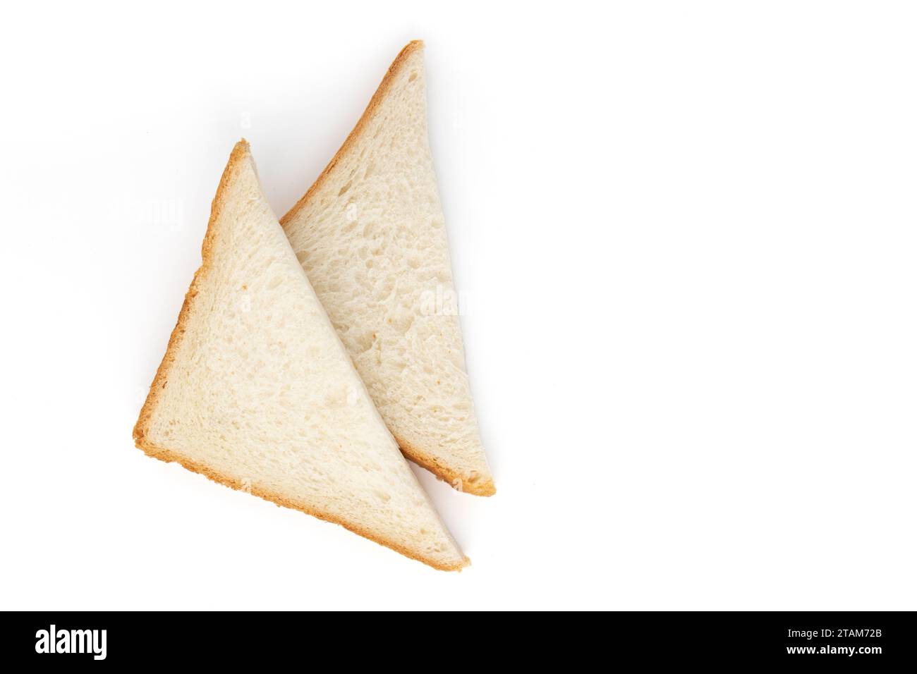 sliced bread cut into triangles isolated on white background, fresh bread for breakfast or lunch