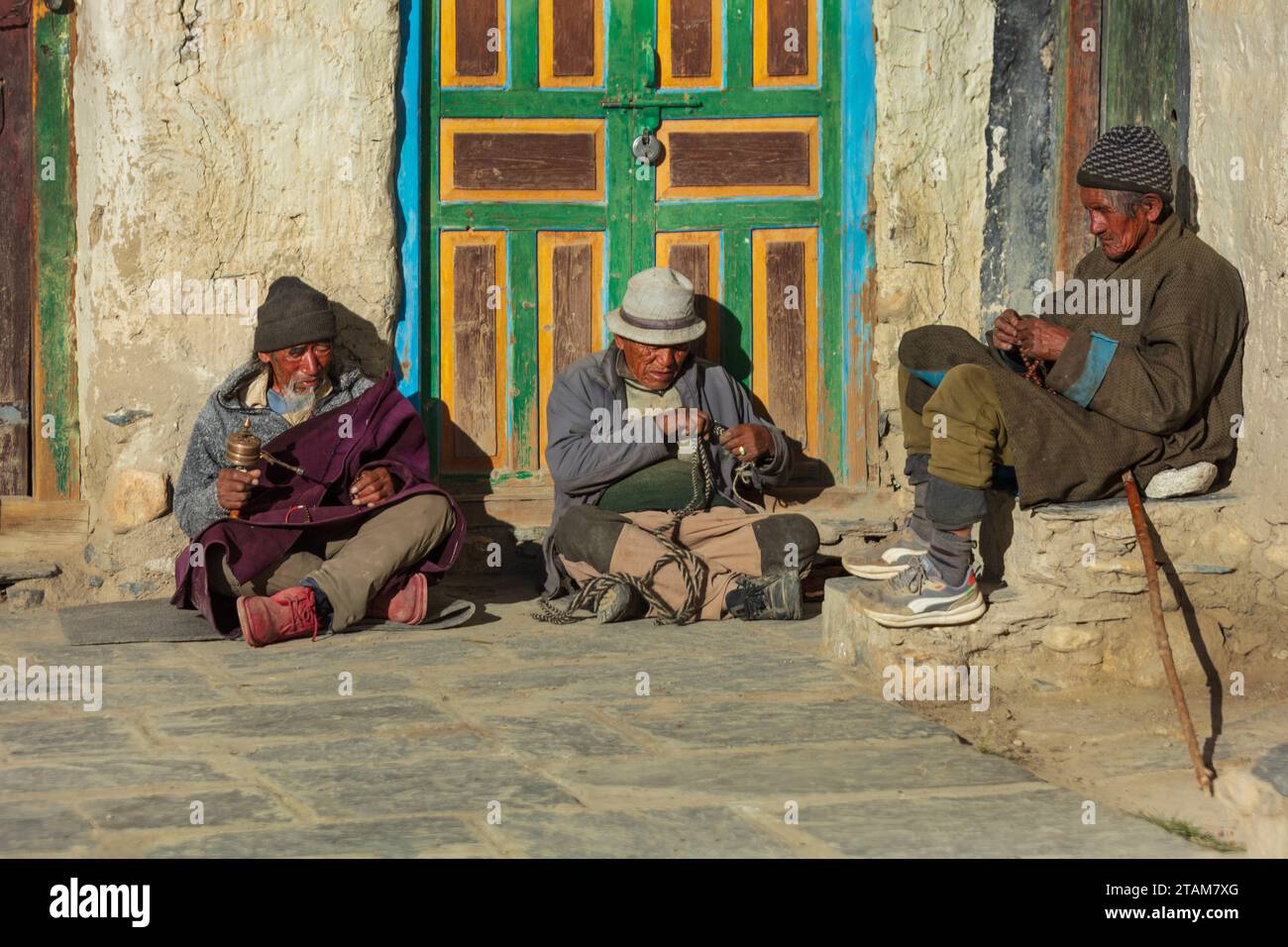 Local man spins their prayer wheel in Lo Manthang, the capital of Mustang District, Nepal Stock Photo