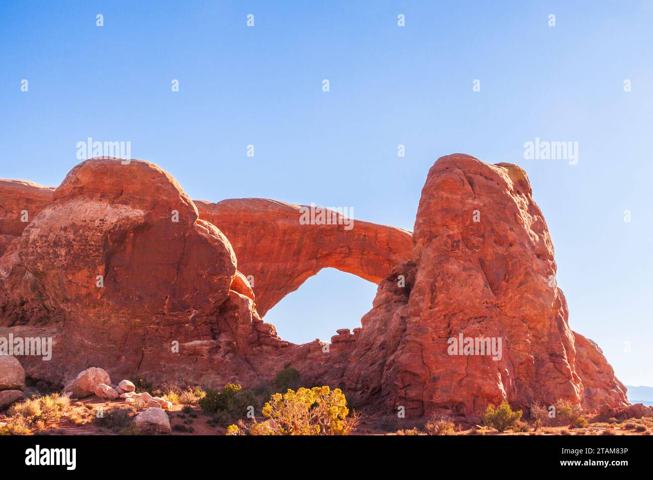 South Window arch sandstone rock formation in early morning light in Arches National Park in Utah. Stock Photo