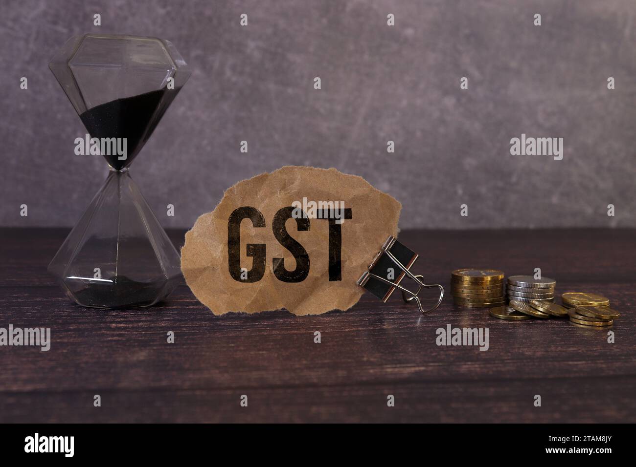gst text concept. Office workplace table with calculator, graphs