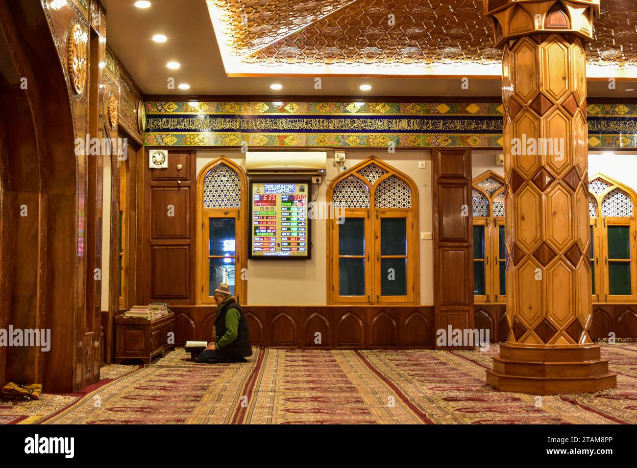 Srinagar, India. 01st Dec, 2023. A man recites the Holy Quran inside the Masjid or Mosque during a cold evening in Srinagar, the summer capital of Jammu and Kashmir. (Photo by Saqib Majeed/SOPA Images/Sipa USA) Credit: Sipa USA/Alamy Live News Stock Photo