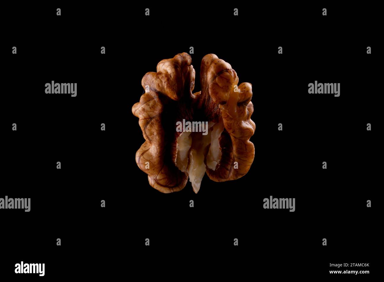 Walnuts on a black brown background. Stock Photo