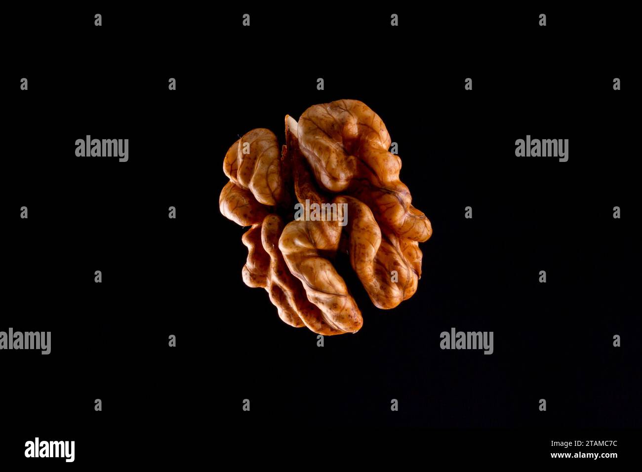 Walnuts on a black brown background. Stock Photo