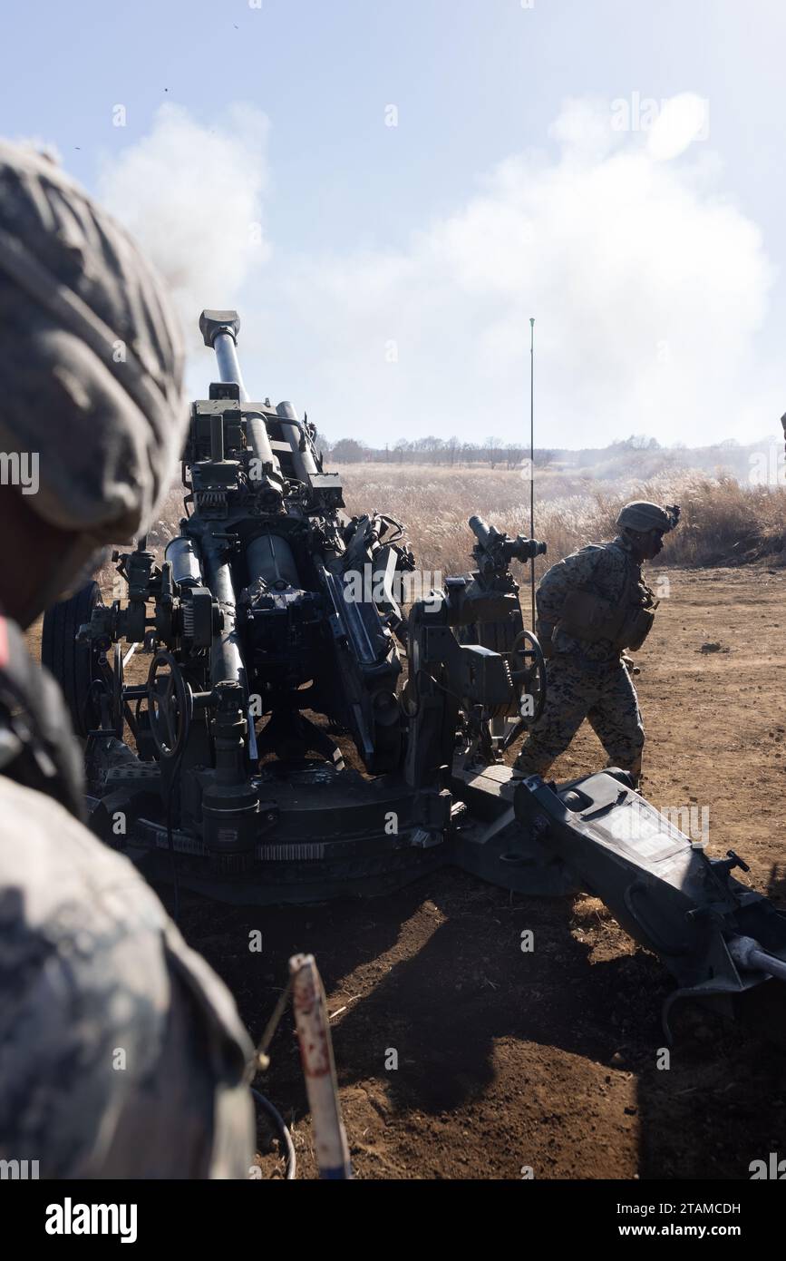 U.S. Marine Corps Cpl. Freeman Diah fires an M777 Howitzer during ...