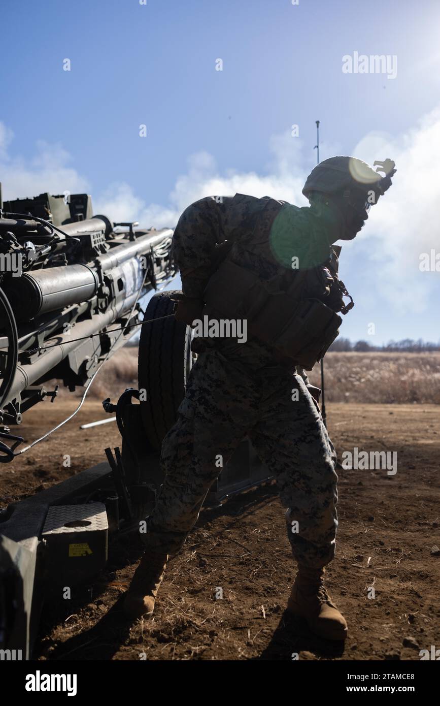 U.S. Marine Corps Cpl. Freeman Diah fires an M777 Howitzer during ...