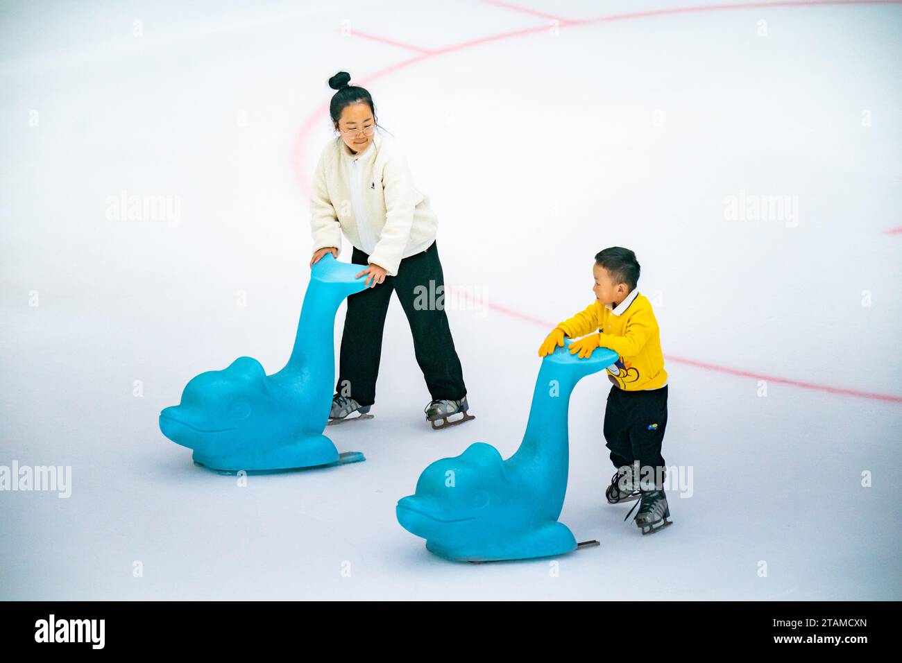 CHONGQING, CHINA - DECEMBER 1, 2023 - A child experiences ice sports at ...