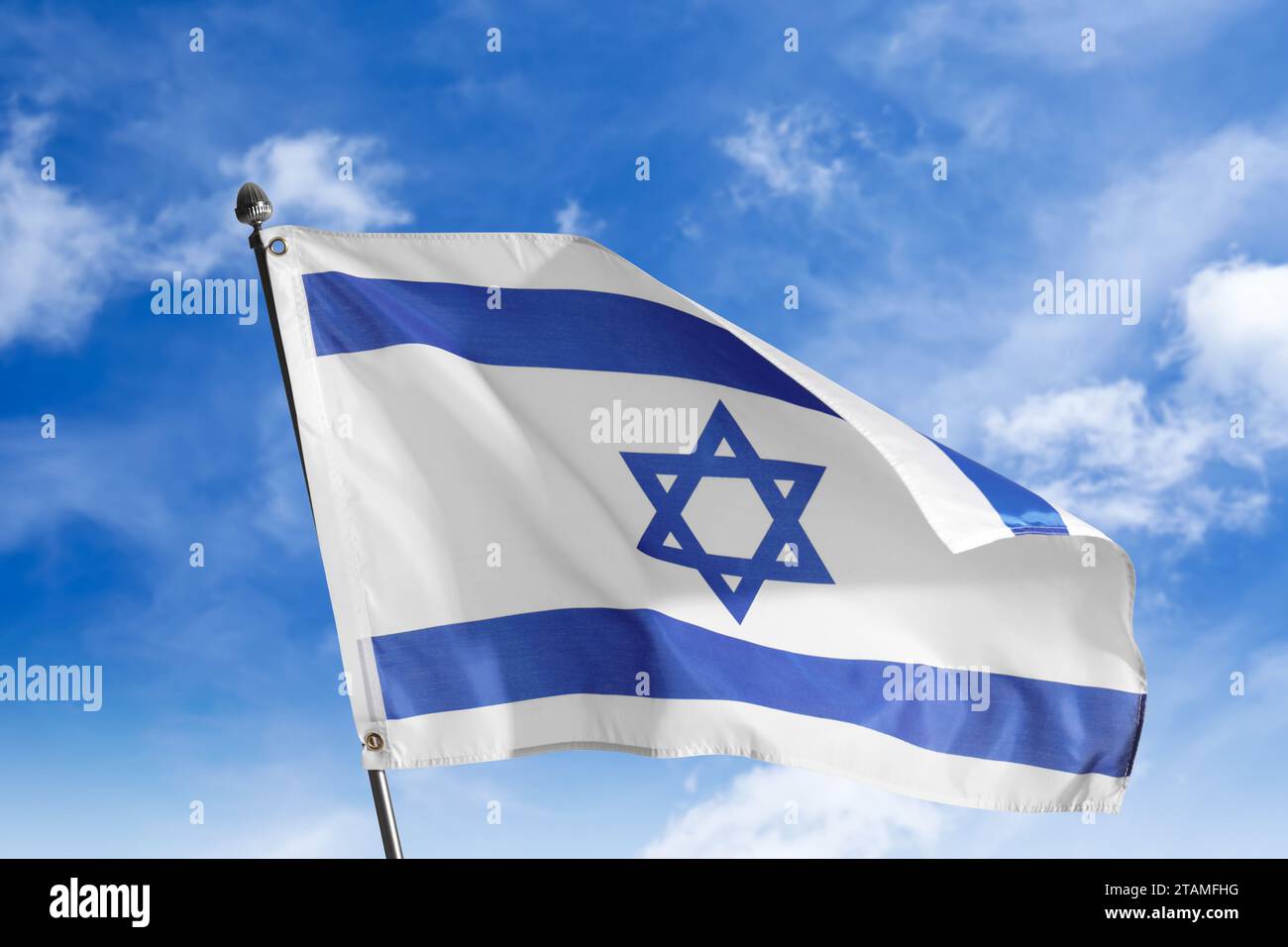 National flag of Israel against blue sky with clouds Stock Photo - Alamy