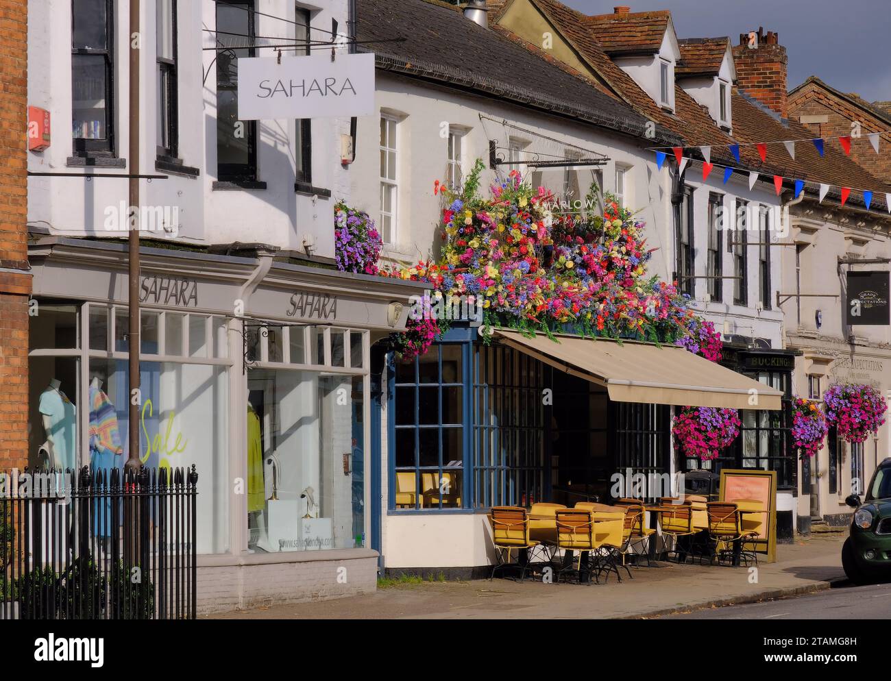 Colourful floral display decorating restaurant in High Street of Marlow on the Thames in Buckinghamshire, England, UK Stock Photo