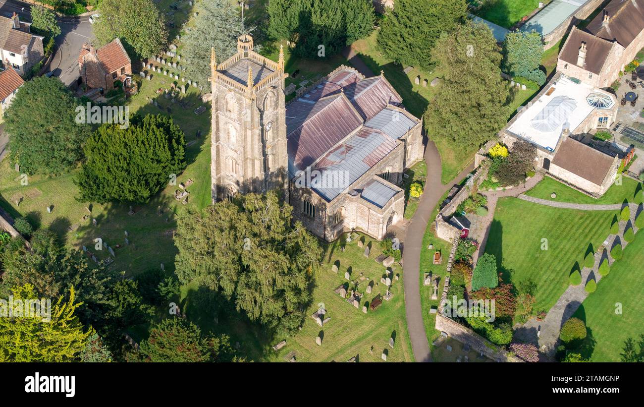 Aerial drone view over St Andrews Church, Chew Magna, Bristol, UK. (03