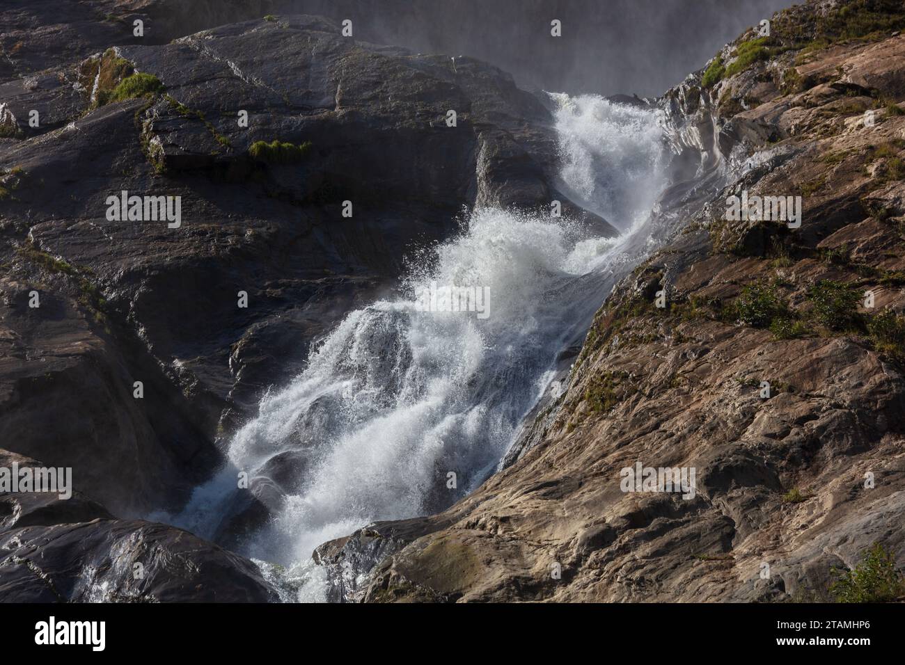 A waterfall in the Kali Gandaki gorge drains glacier from above - Lower Mustang District, Nepal Stock Photo