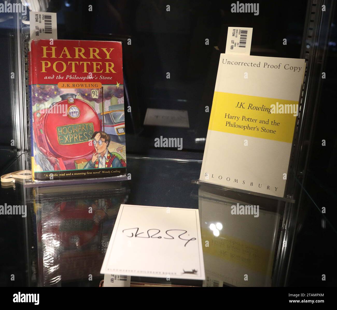 New York, New York, USA. 30th Nov, 2023. (L) J.K. Rowling Harry Potter and the Philosopher's Stone one of 500 hardback first editions estimate $10,000 - $15,000 and (R) J.K. Rowling uncorrected proof Harry Potter and the Philosopher's Stone with signature estimate $12,000 -$18,000seen during the press preview for the fine books and manuscripts auction during Luxury Week at Sotheby's New York. (Credit Image: © Nancy Kaszerman/ZUMA Press Wire) EDITORIAL USAGE ONLY! Not for Commercial USAGE! Stock Photo