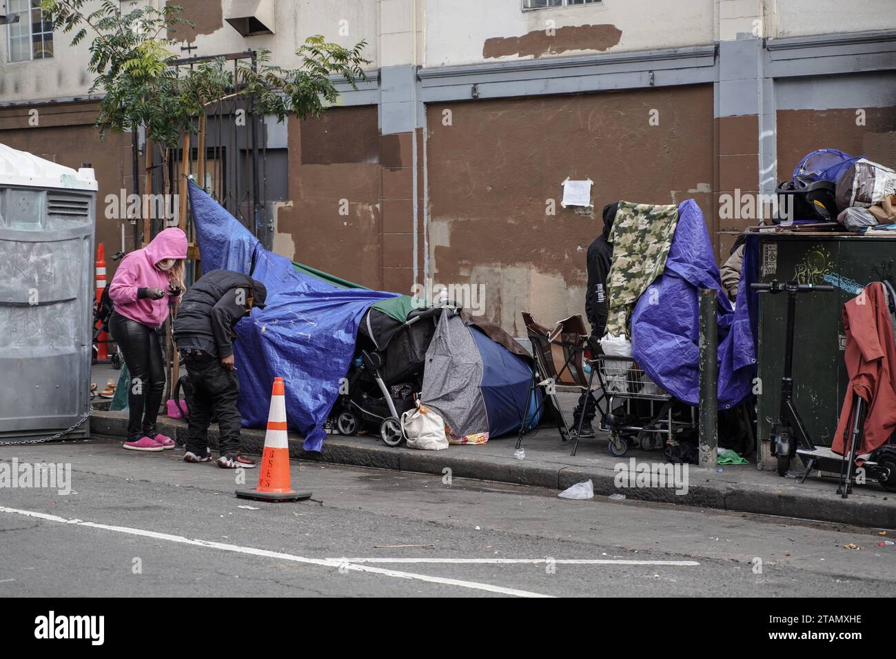 The belongings and tents of homeless people are seen on the street ...