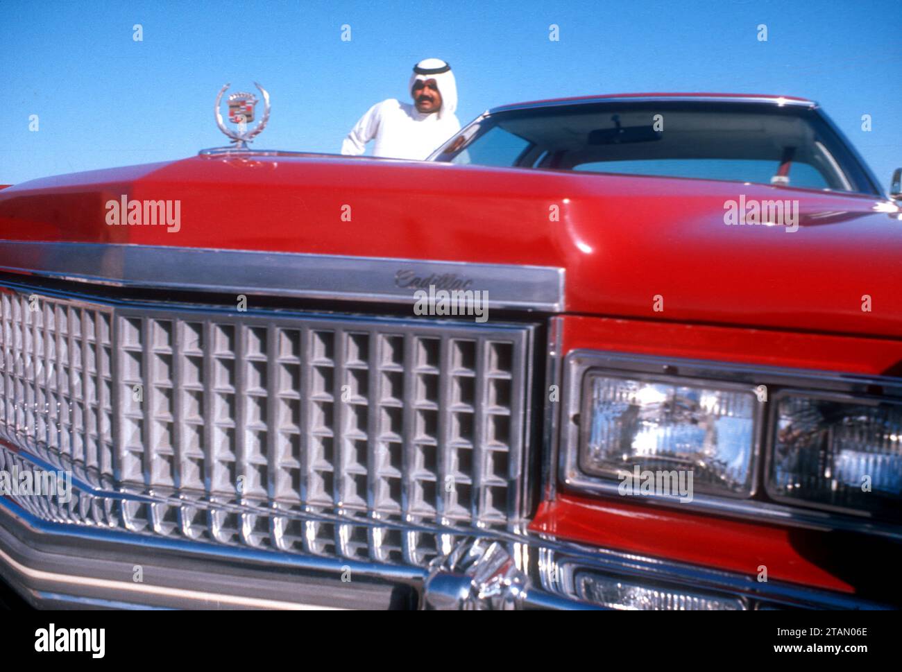 Oil sheikh posing with his Cadillac, United Arab Emirates, 1975 Stock Photo