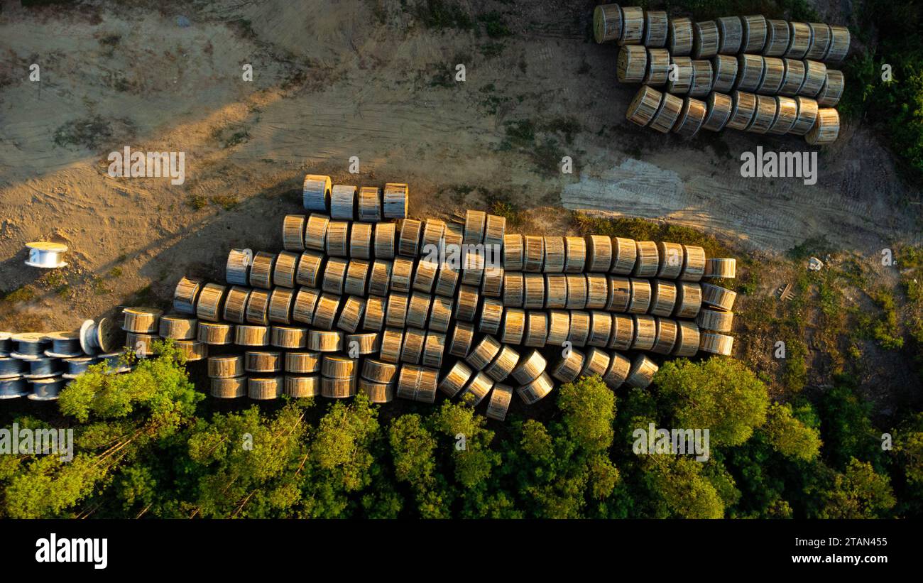 Wooden Coils of Electrical wires at outdoor construction site. High