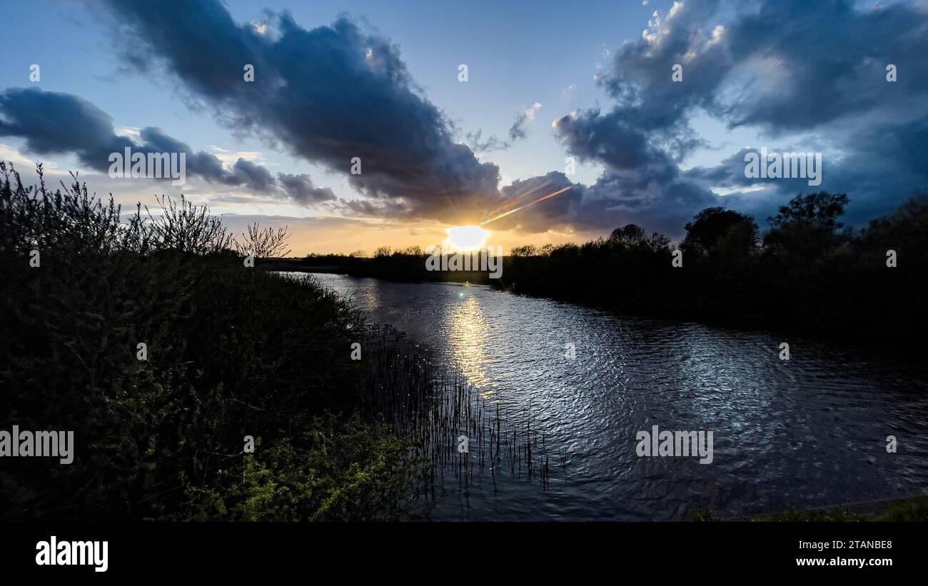 Evening light over the river Vidå near the town of Tønder in Southern Denmark Stock Photo