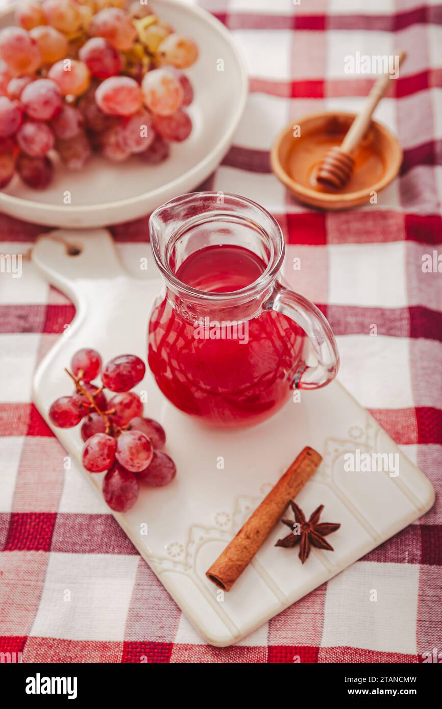 Homemade organic red vinegar with cinnamon and anise. Red grape