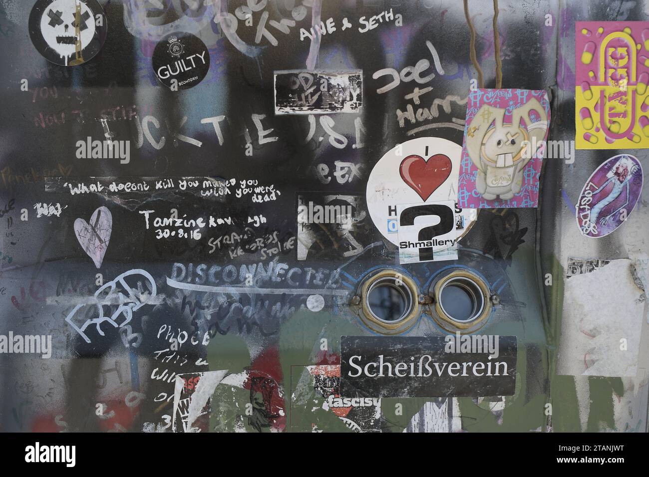 Graffiti and stickers on a wall Stock Photo Alamy