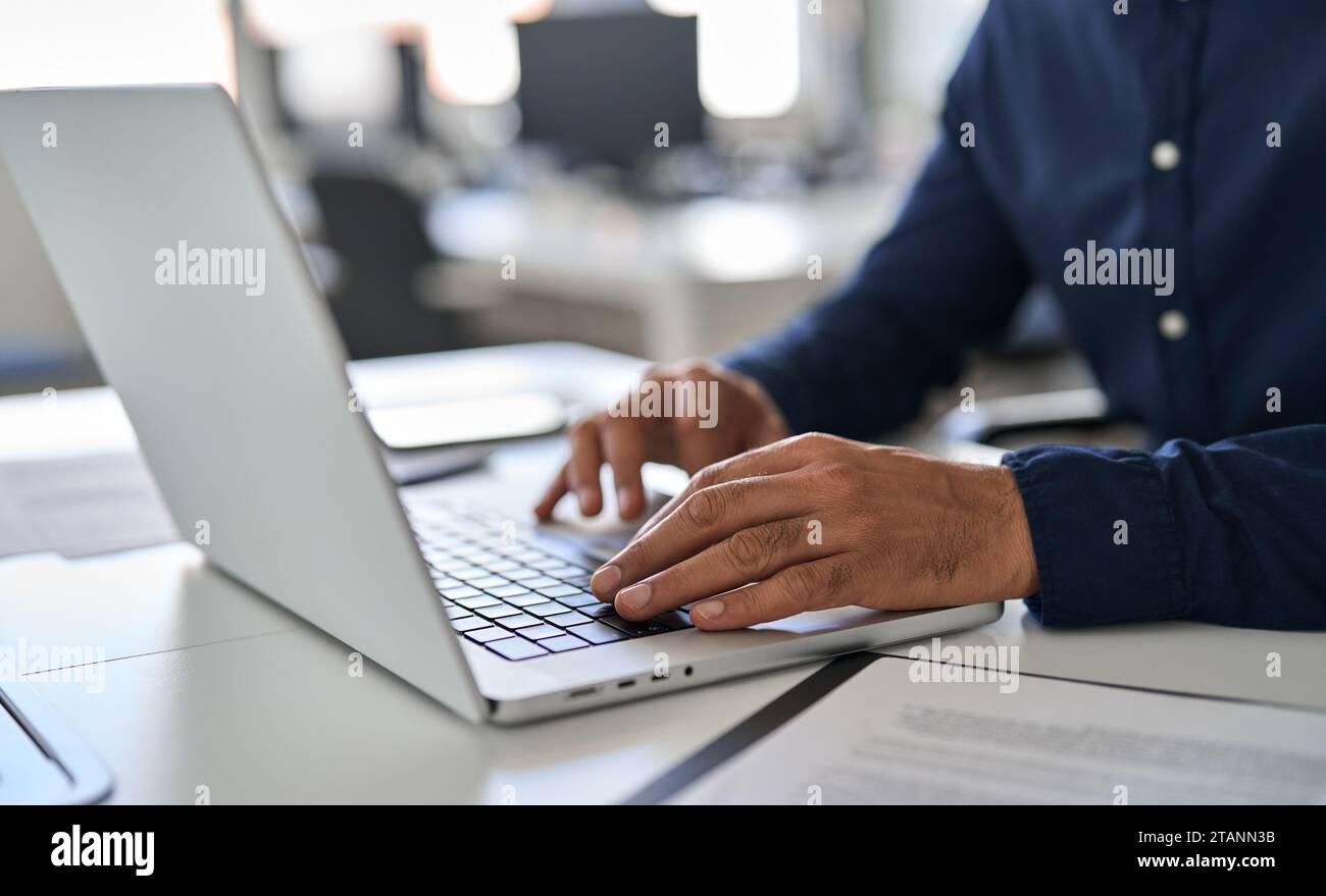 Hands of business man typing on laptop working with ai solutions on computer. Stock Photo