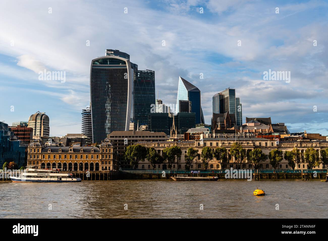 London, UK - August 26, 2023: Cityscape of London by Thames River at sunset Stock Photo