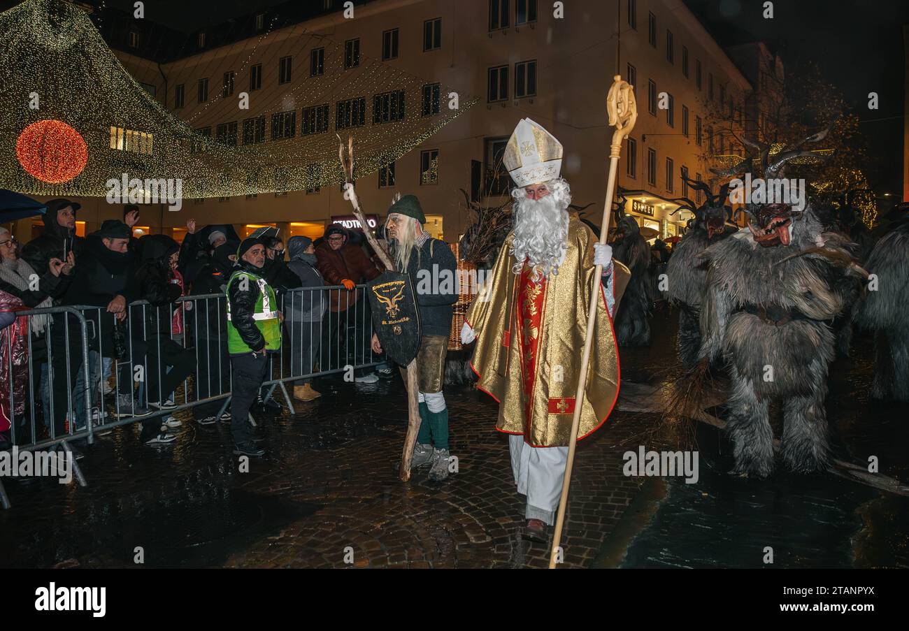Villach, Austria - December 1, 2023: Krampuslauf parade, mask show of devils and St. Nicholas, fun show in the city center, more than 40 groups from C Stock Photo