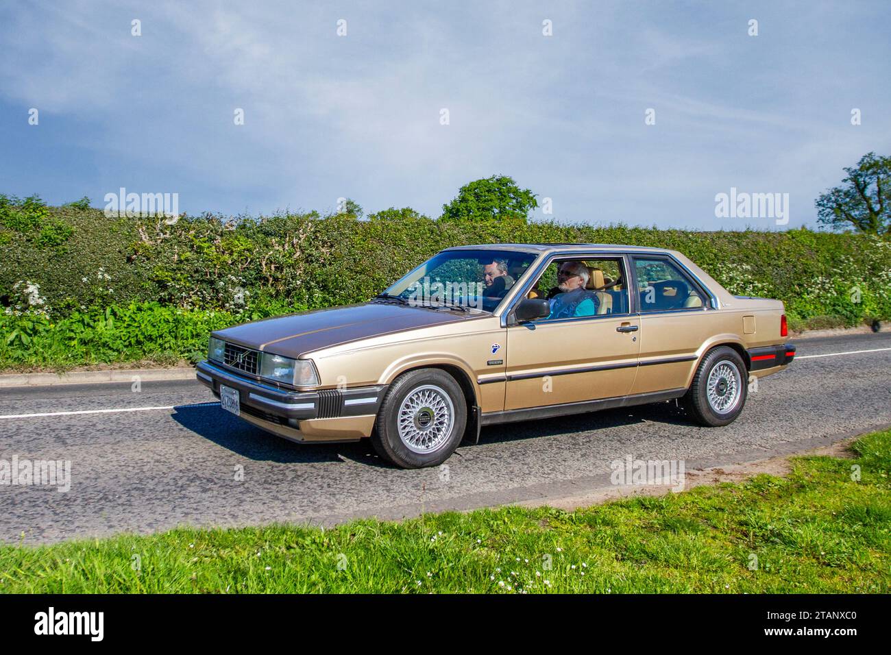 1990 90s nineties California Volvo 780 Bertone 2.3-litre  Coupe. Champagne four-cylinder, turbocharged, 4-speed auto, rear-wheel drive; Vintage, restored classic motors, automobile collectors motoring enthusiasts, historic veteran cars travelling in Cheshire, UK Stock Photo