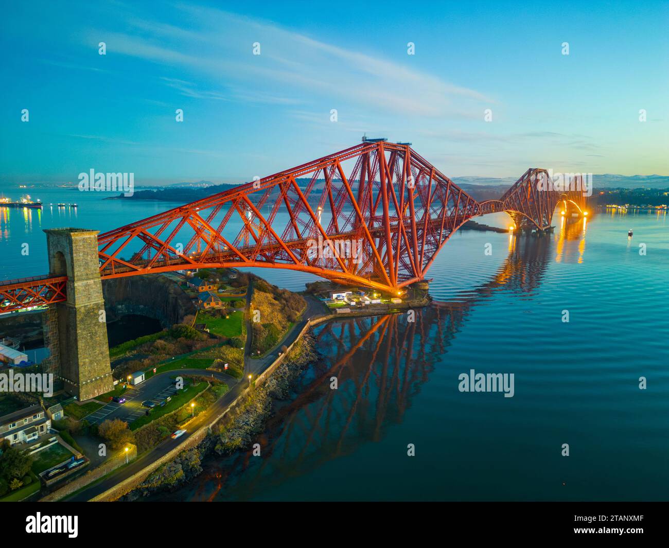 Aerial view from drone at dusk of the Forth Bridge crossing the Firth of Forth, Fife, Scotland, UK Stock Photo